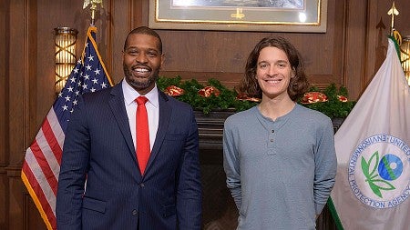 An EPA official posing with a UO student